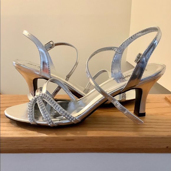 Strappy silver shoes with rhinestones
Heel is 2.75” H - Picture 3 of 5